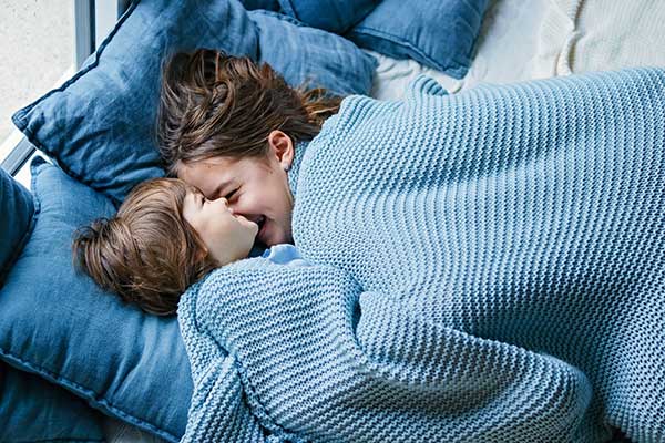 Fall and Winter Energy Saving Tips | Children Snuggle under Blanket Fall and Winter Energy Saving Tips | Children Snuggle under Blanket