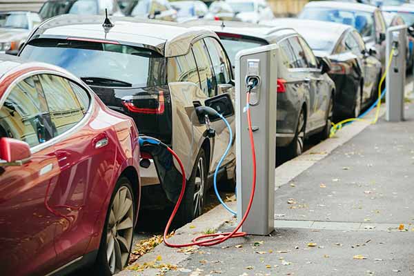 EV Makers Electric Cars Being Charged EV Makers Electric Cars Being Charged