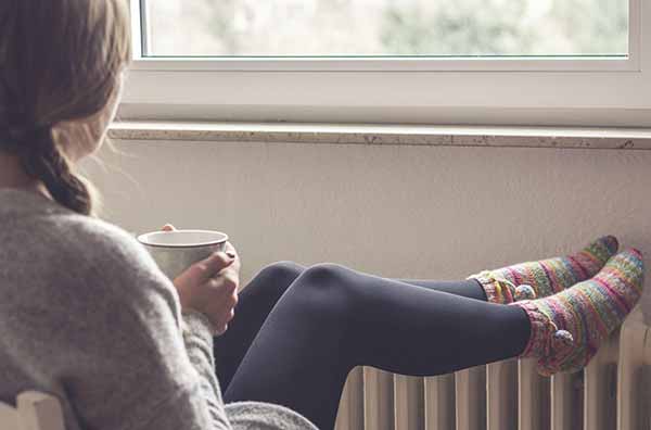 Europe Energy | Poor Lady sitting with Warm coffee