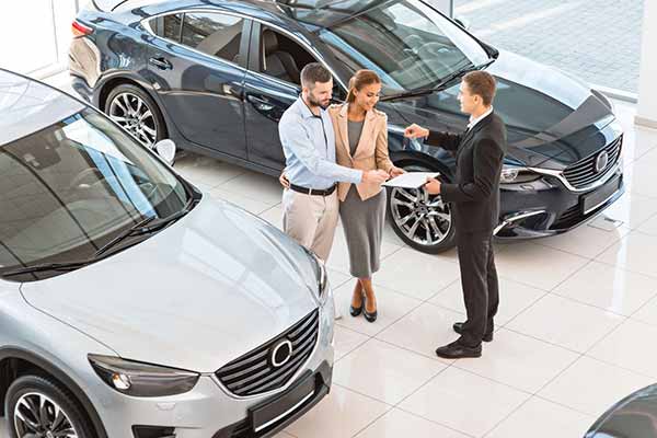 Hertz Deal Pushes Tesla | mage of Car Dealership