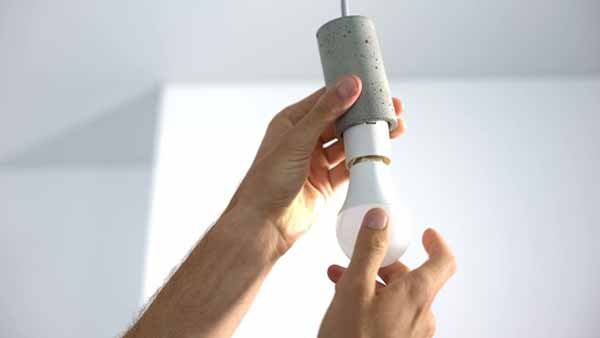 Home Owner Changes Light Bulb