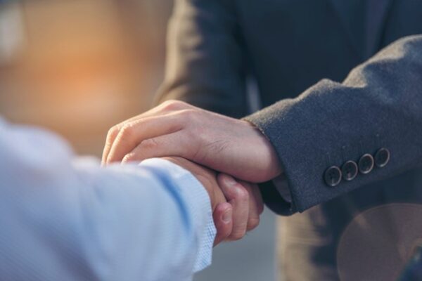 Men shaking Hands Over Energy Agreement
