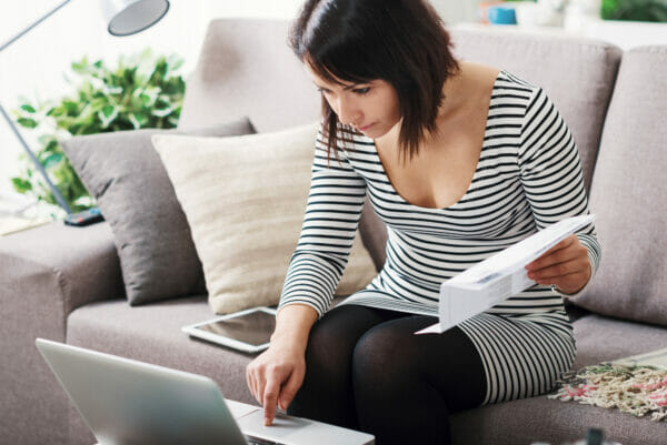 Photo of Woman Comparing EnergySavings.com vs. SaveOnEnergy Bills Photo of Woman Comparing EnergySavings.com vs. SaveOnEnergy Bills