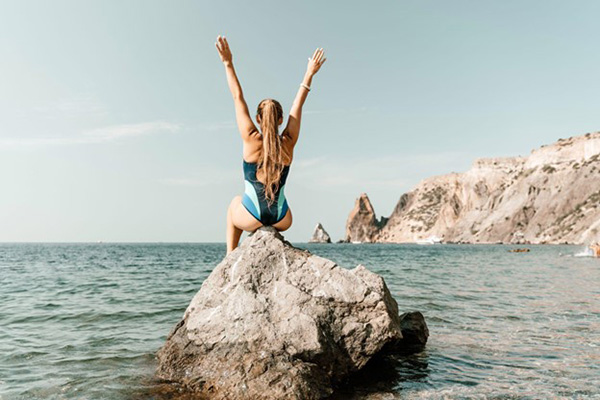 Woman on Rock Illustration of Energy Conservation