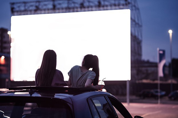 Lubbock Texas.Two Girls Enjoy Drive in Movie Lubbock Texas.Two Girls Enjoy Drive in Movie