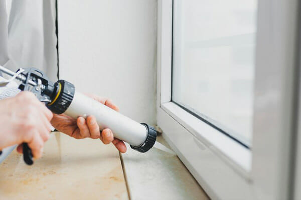 Silicone Stop Air Leaks Man Applies Caulking