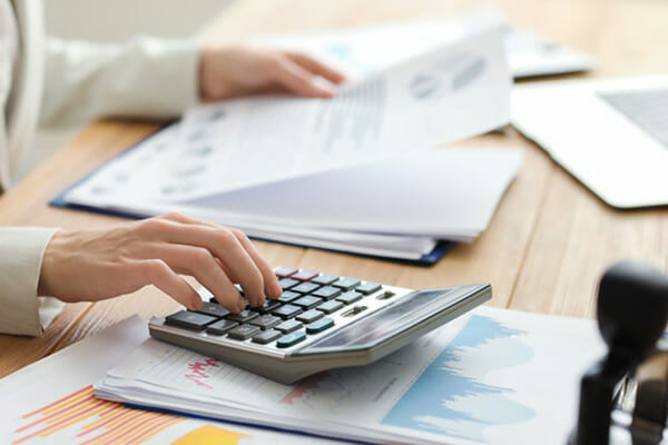 Woman Calculates Saving Options from Energy Ogre