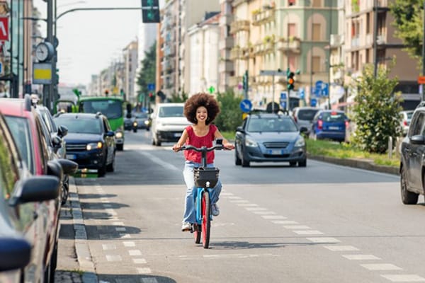 Sustainable Transport Woman Smiles on Bike Sustainable Transport Woman Smiles on Bike
