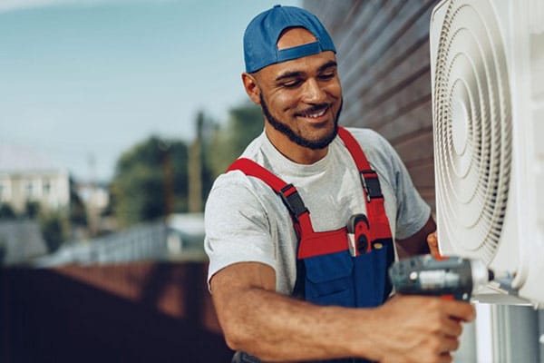 Texas Worker Ensuring HVAC Efficiency