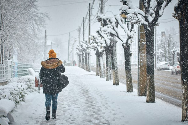 AI Weather Forecasting Image of Woman Outdoors Snowfall