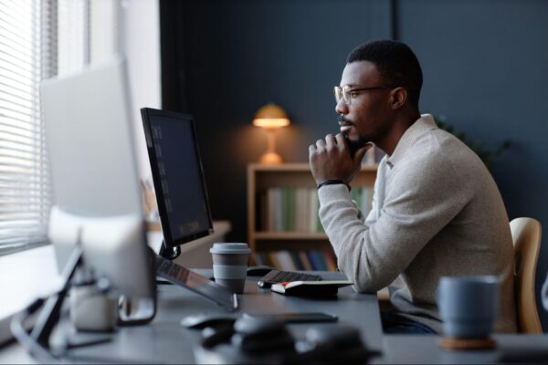 A man looking at a computer screen