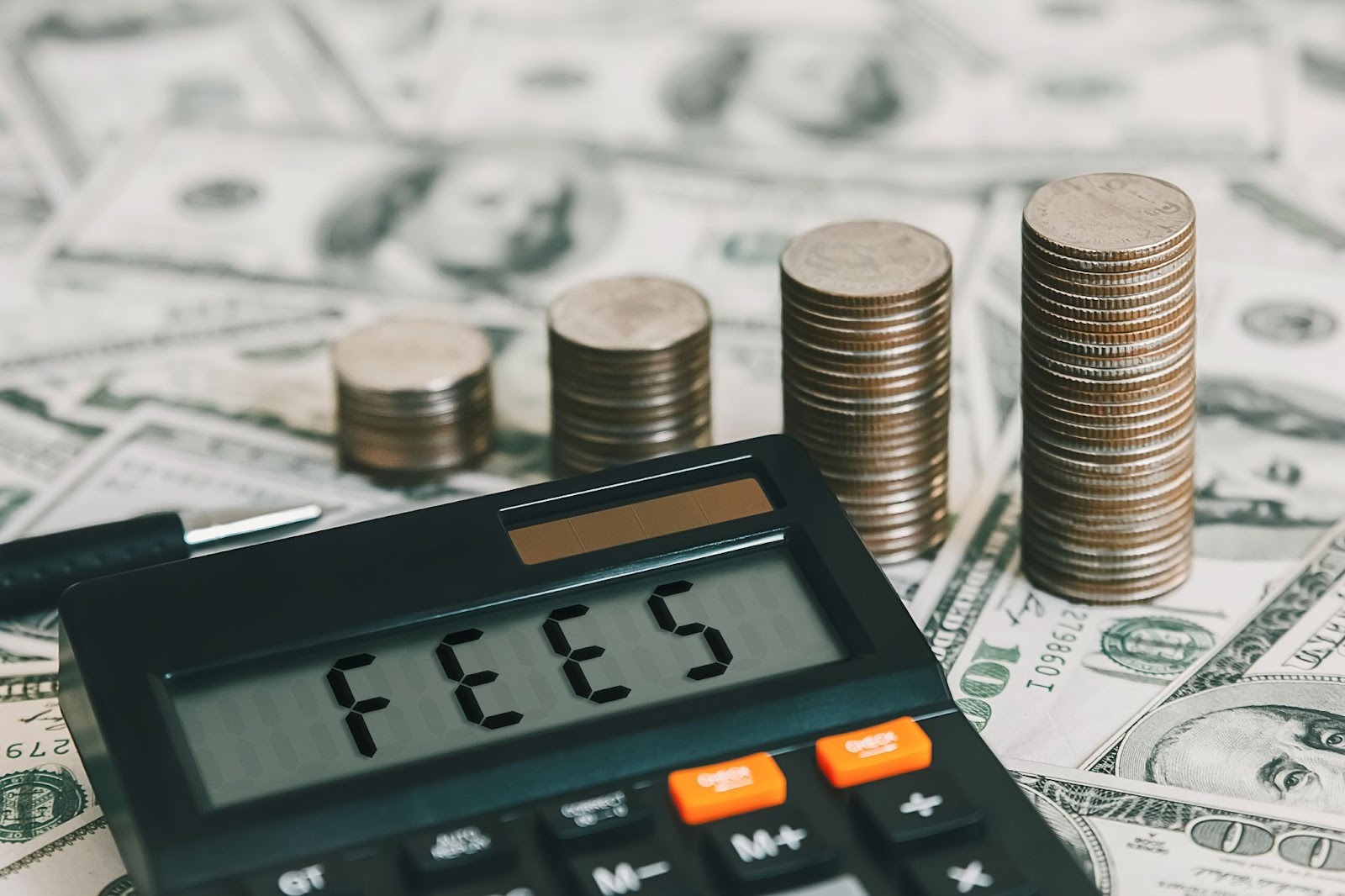 An image of a calculator that says FEES on the dashboard